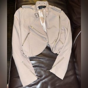 Akira crop moto jacket with buckles and zip design